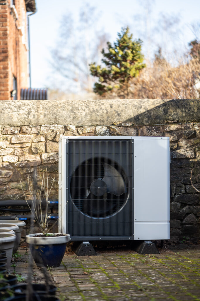 Image of an external condensing unit for an ASHP.