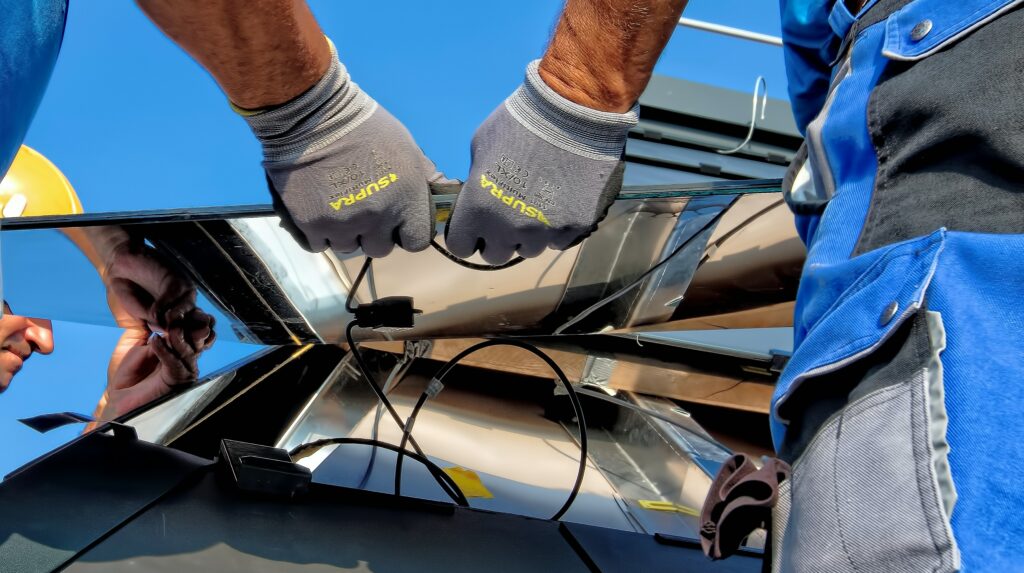 Workers installing solar panels